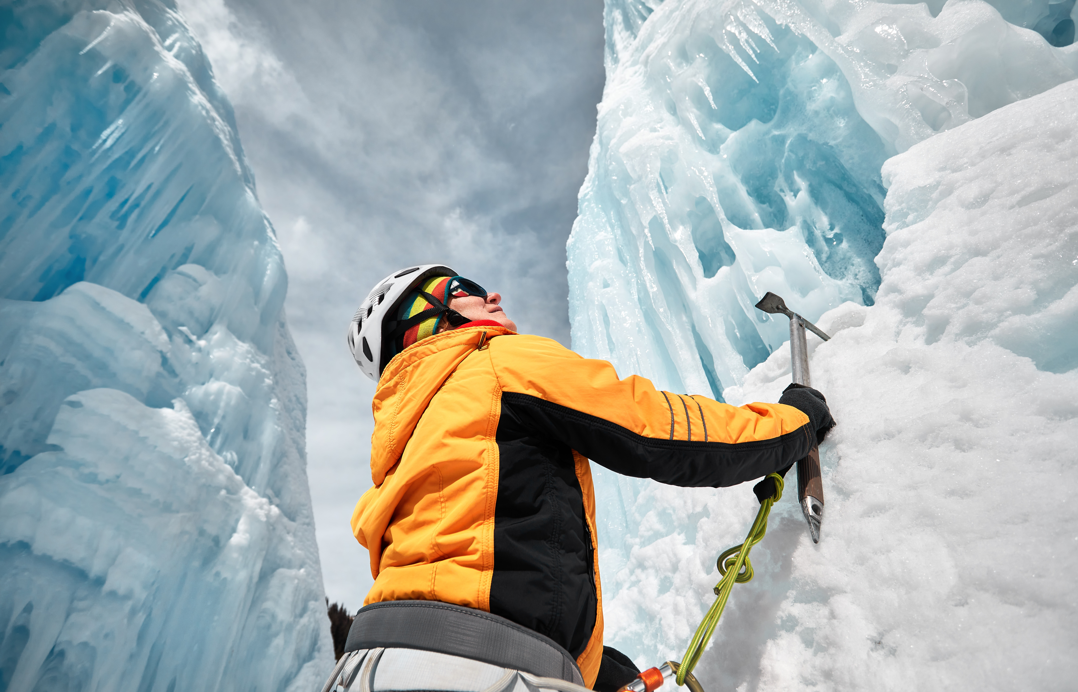A person climbing an icy cliff